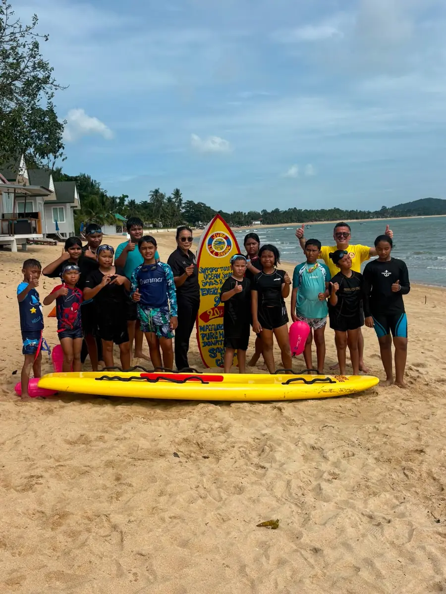 Surf Club children and volunteers at the beach
