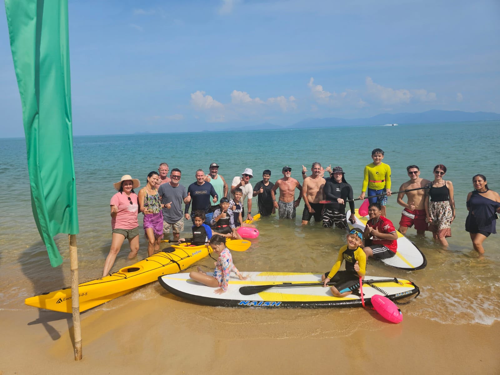 Kids and volunteers at the beach