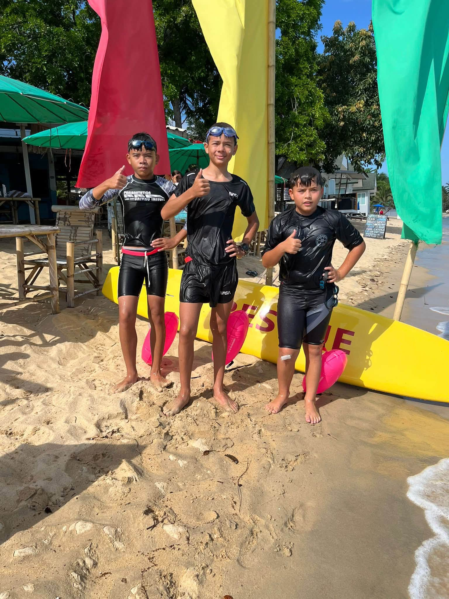 Young Koh Samui Surf Lifesaving Club swimmers on the beach