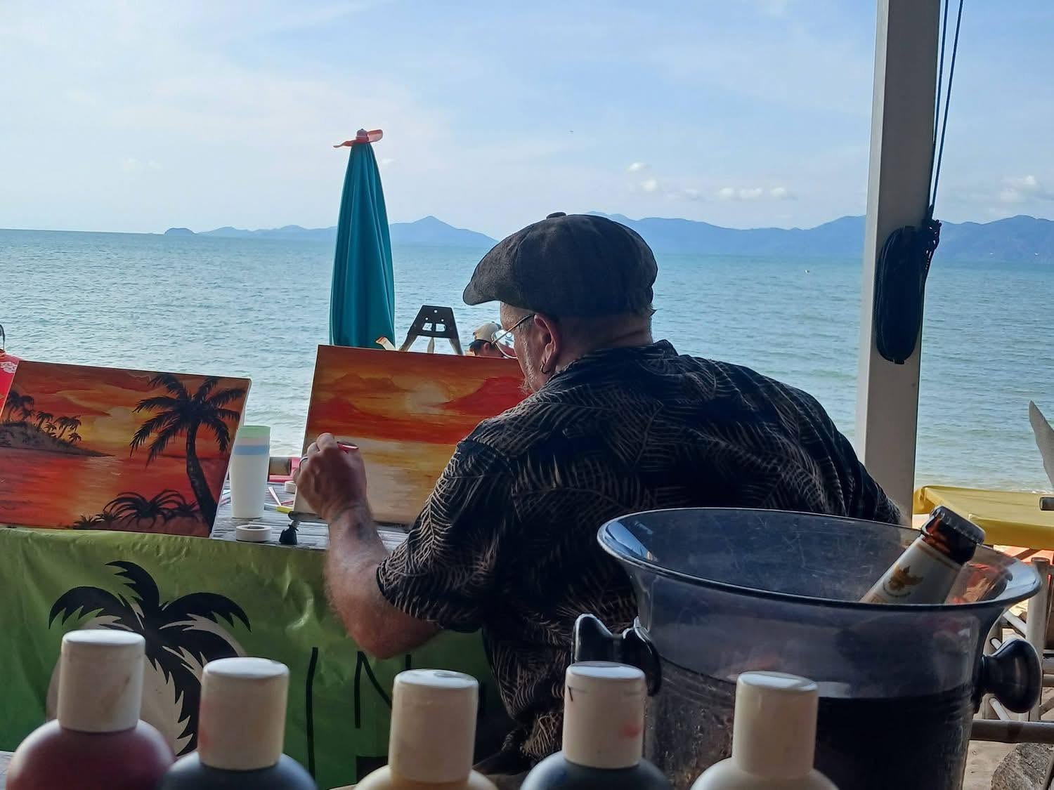Tony volunteering his time to show the ladies how to paint over a wine or two