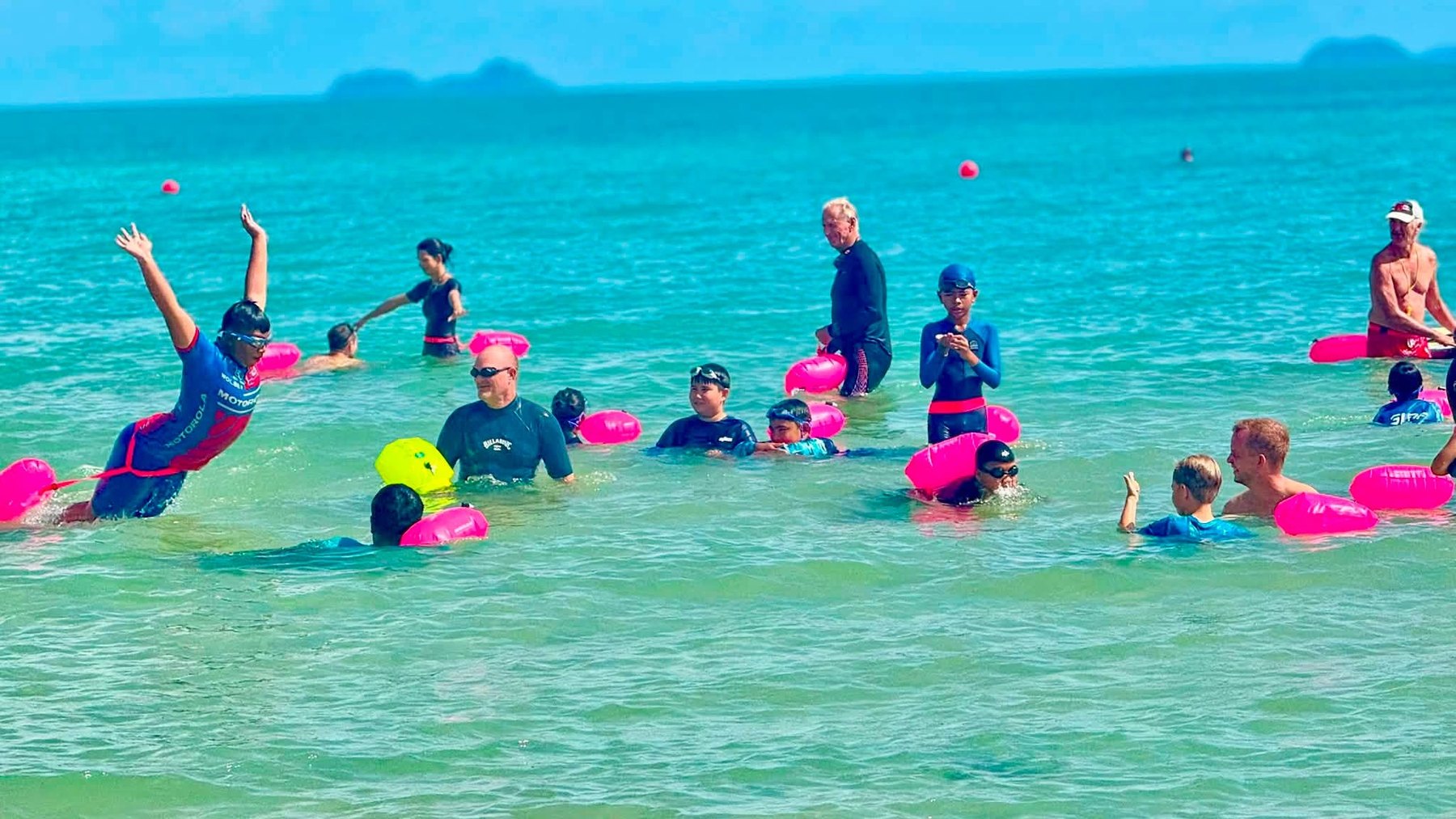Children and volunteers practising water safety