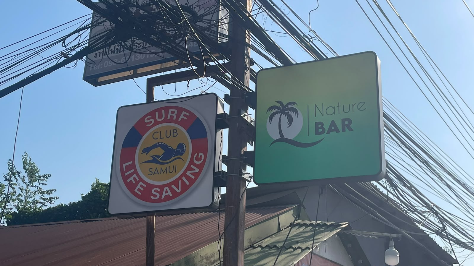 Nature Bar and Surf Club road signs