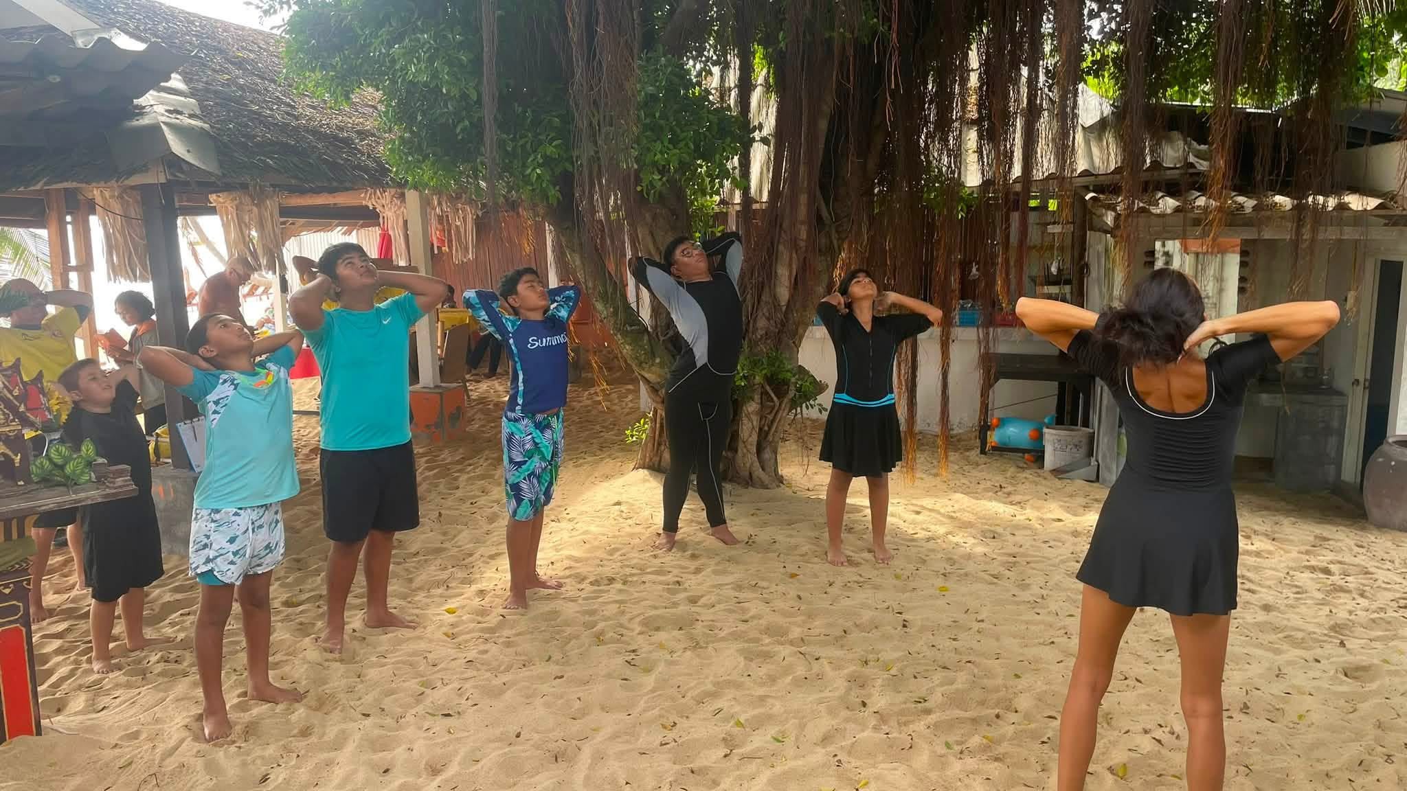 Juliette leading the children through pre-swim yoga