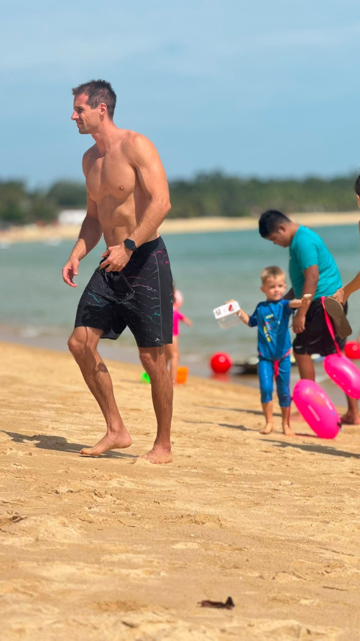 Tom helping at the beach